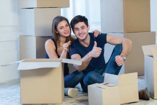 Professional movers working in a Brixton flat with stairs