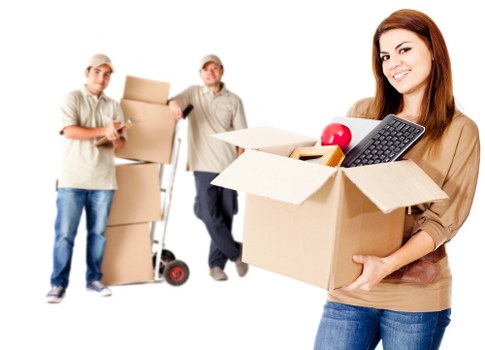 Professional movers handling household items in a Brixton property