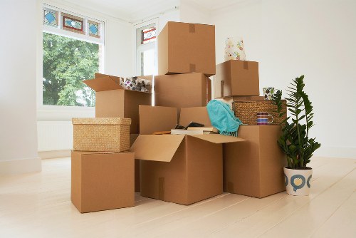 Packed desks and labelled boxes ready for an office relocation in Brixton