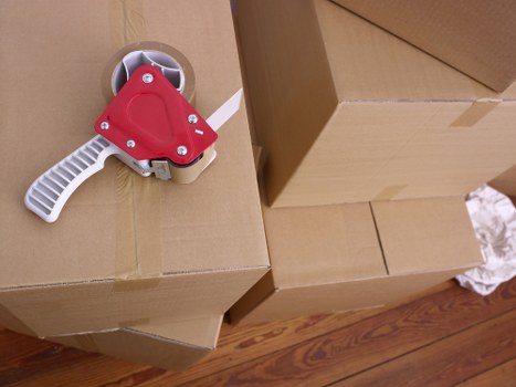 Unpacking boxes into a new Brixton flat after a move